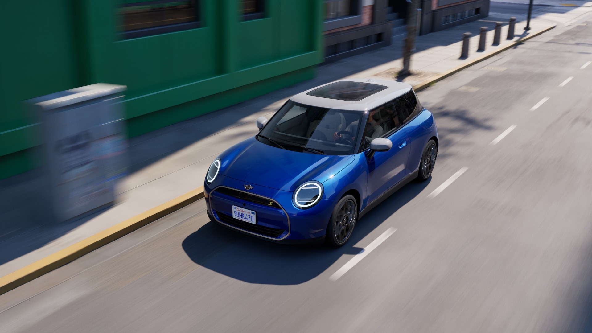 All- electric MINI Cooper driving down the road 